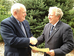 Robert M. Wells, Director of Training for the National and International Maritime Law Enforcement Academies, right, presents a Document of Certification to William H. Watson, President of AdvanFort, attesting to the fact that he company's Counter Piracy Security Training programs meet or exceeds international standards. The certification followed a detailed audit of the programs. Robert M. Wells, Director of Training for the National and International Maritime Law Enforcement Academy, right, presents a Document of Certification to William H. Watson, President of AdvanFort, attesting to the fact that he company's Counter Piracy Security Training programs meet or exceeds international standards. The certification followed a detailed audit of the programs.